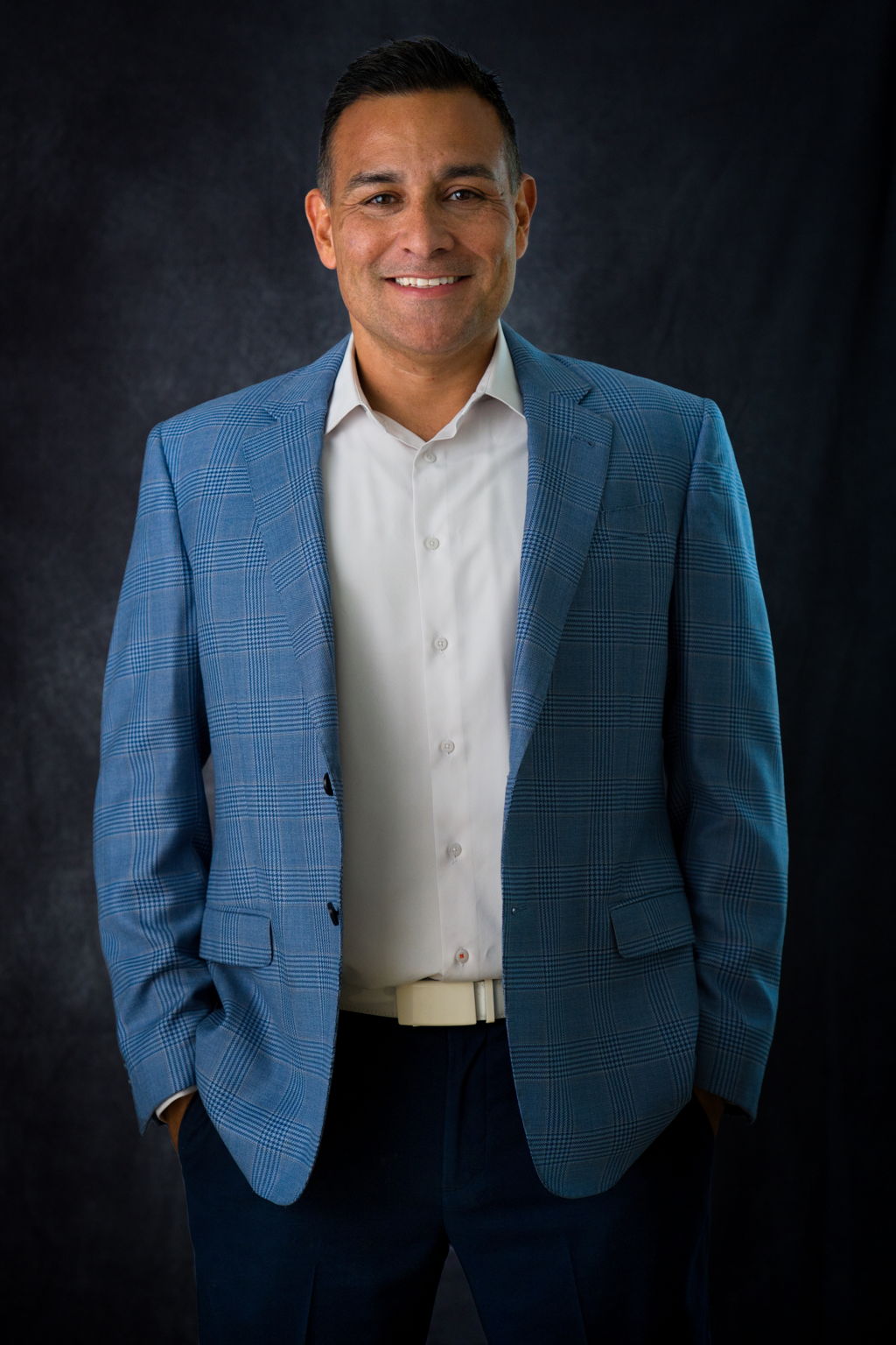 Juan Concheiro in a blue blazer and white shirt